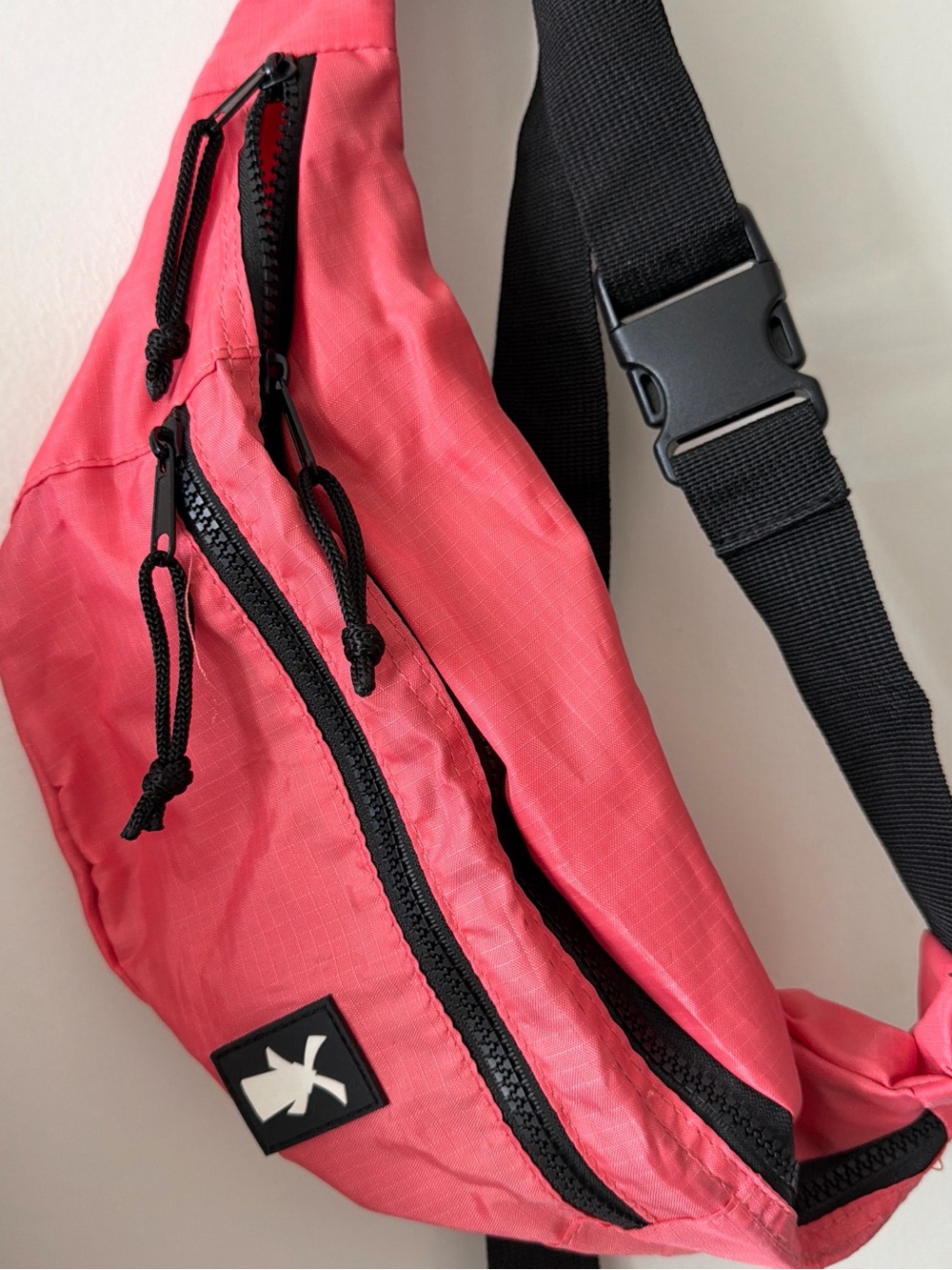 Dutch Bros Coral Pink Crossbody Sling Bag with Black Strap